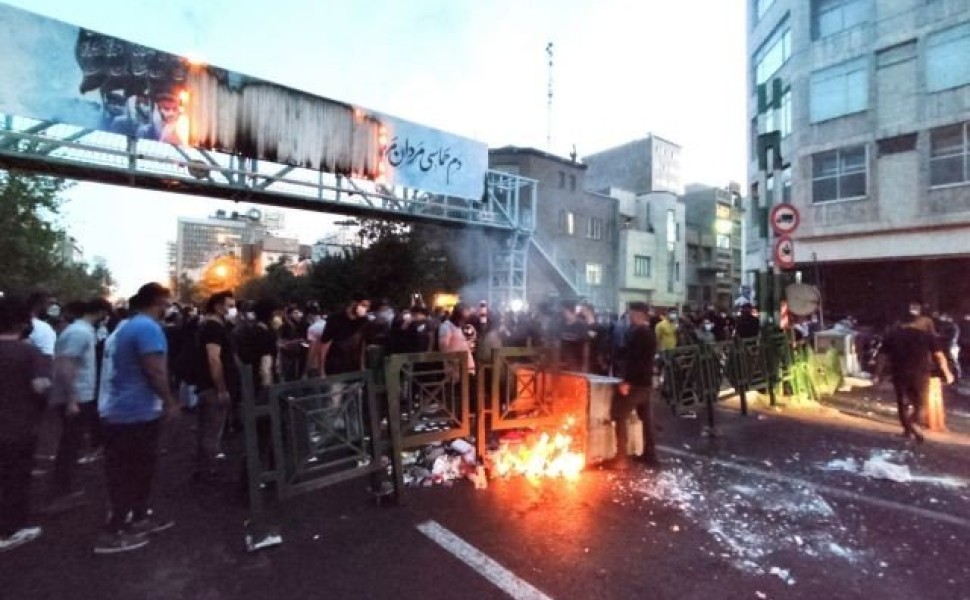 FILE PHOTO: People light a fire during a protest over the death of Mahsa Amini, a woman who died after being arrested by the Islamic republic's "morality police", in Tehran, Iran September 21, 2022. WANA (West Asia News Agency) via REUTERS ATTENTION EDITO