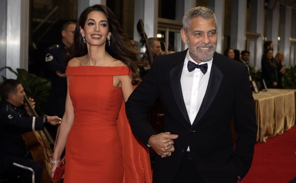 epa10347298 George Clooney and wife, Amal arrive for the formal Artist's Dinner honoring the recipients of the 45th Annual Kennedy Center Honors at the Department of State in Washington, DC, USA, 03 December 2022. The 2022 honorees are: actor and filmmake