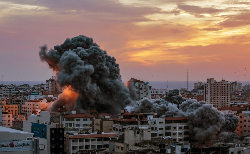epaselect epa10906107 Smoke rises after Israeli warplanes targeted the Palestine tower in Gaza City, 07 October 2023. Rocket barrages were launched from the Gaza Strip early 07 October in a surprise attack claimed by the Islamist movement Hamas. In a tele