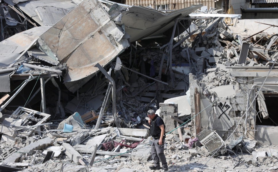 epa10906897 Police at the scene of a destroyed building in Tel Aviv, Israel, 08 October 2023, following overnight Hamas rocket attacks. Rocket barrages were launched from the Gaza Strip as of early 07 October in a surprise attack claimed by the Islamist m