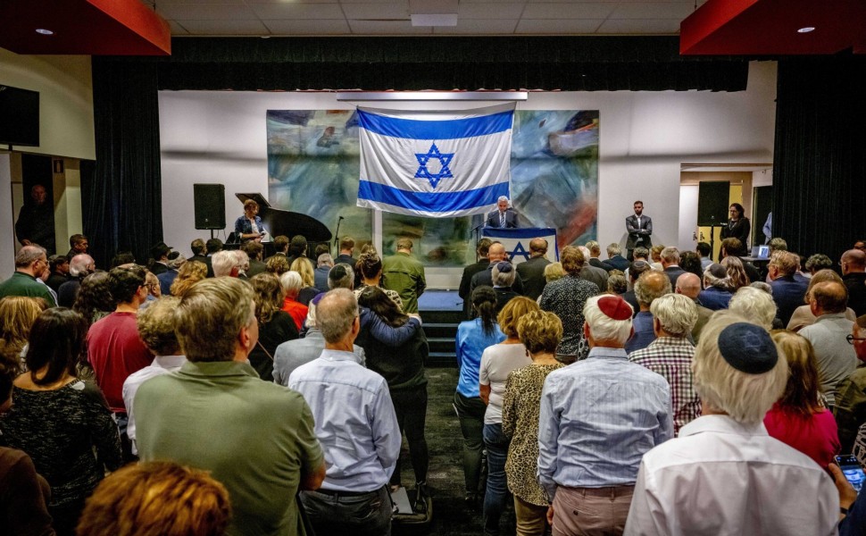 epa10908314 Israel's Ambassador to the Netherlands Modi Ephraim (rear C) speaks during the Together for Israel meeting at the Jewish Cultural Center (JCC) in Amsterdam, the Netherlands, 08 October 2023. Various organizations came together to discuss the l