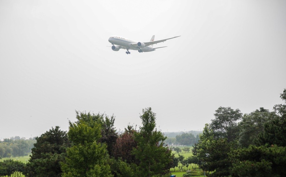 epa10800916 A passenger airplane lands in Beijing Captial International Airport in Beijing, China, 15 August 2023. The Biden administration announced on August 11 that the US and China will authorise twice the number of passenger flights permitted for air