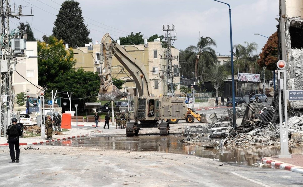 epa10907033 Israeli security forces inspect the damage and remove the debris outside the destroyed police station that was controlled by Hamas militants in the southern city of Sderot, close to the Gaza border, Israel, 08 October 2023. Rocket barrages wer