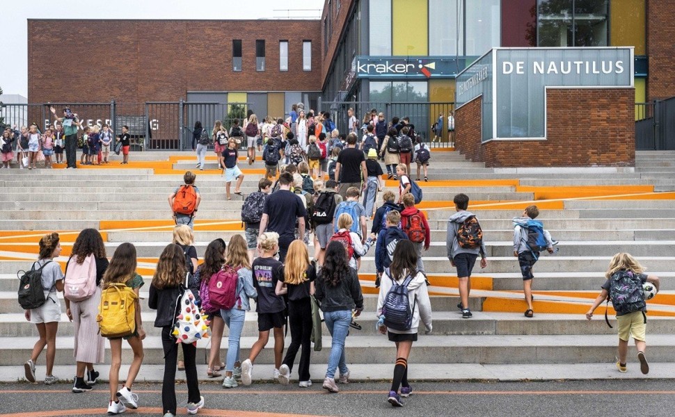 epa08608492 Children arrive to school on the first day of the new school year in Amsterdam, Netherlands, 17 August 2020. Restrictions were enforced amid the ongoing coronavirus pandemic. Parents are currently only allowed to enter the schoolyard after ans