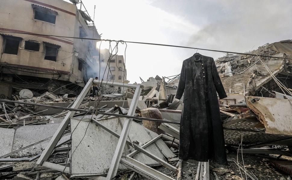 epa10907290 A coat hangs beside the rubble at the site of the destroyed Al-Watan Tower following Israeli air strikes, in Gaza City, 08 October 2023. The air strikes, in retaliation for the 07 October Hamas rocket attacks on Israel, have killed over 300 pe