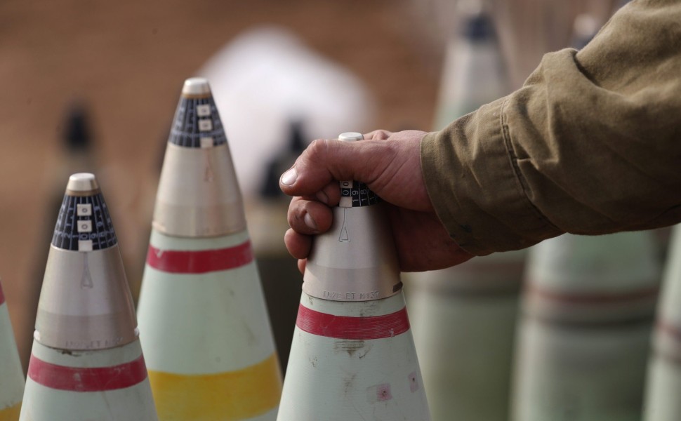epaselect epa10909856 An Israeli artillery soldier checks shells at an area along the border with Gaza, southern Israel, 09 October 2023. Israeli chief military spokesperson Rear-Admiral Daniel Hagari said on 09 October that the country had drafted a reco