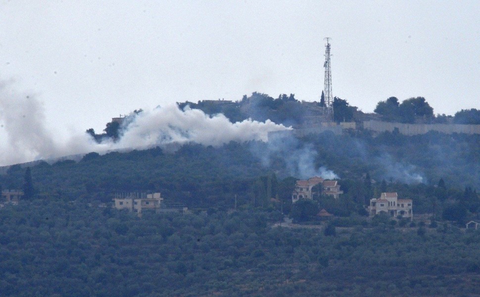 epa10913223 Smoke rises from positions on a hill after Israeli shelling on the outskirts of Dhayra village, near the Lebanese-Israeli border, Lebanon, 11 October 2023. Hezbollah said on 11 October it fired missiles on Israel, two days after three of its m