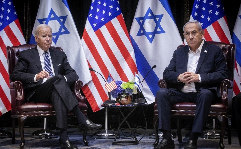 epa10925734 US President Joe Biden (L) looks on during a meeting with Israeli Prime Minister Benjamin Netanyahu (R) in Tel Aviv, Israel, 18 October 2023. President Biden pledged US support for Israel and said the overnight attack on a hospital in the Gaza