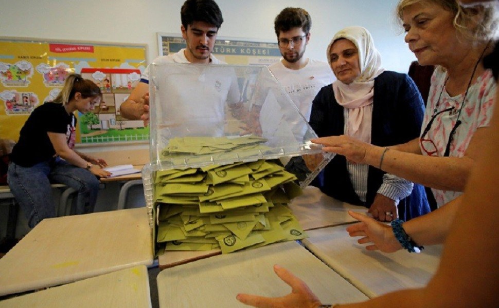 FILE PHOTO: Election officials open a ballot box to count votes at a polling station in Istanbul, Turkey, June 23, 2019. REUTERS/Kemal Aslan/File Photo