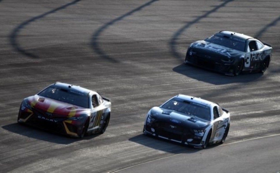 Jun 25, 2023; Nashville, Tennessee, USA; NASCAR Cup Series driver Bubba Wallace (23) leads NASCAR Cup Series driver Aric Almirola (10) and NASCAR Cup Series driver Austin Dillon (3) into turn two during the Ally 400 at Nashville Superspeedway. Mandatory C